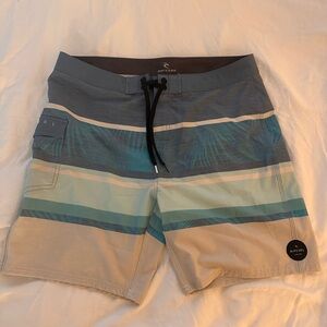 Brand new (no tags) Rip Curl men’s bathing suit board shorts. Size 36 (Large)